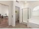 Well-lit bathroom featuring a glass enclosed shower, separate toilet room and soaking tub at 10322 E Excavation Ct, Gold Canyon, AZ 85118