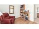 Bedroom with a leather chair, bookshelf, and wood flooring at 10322 E Excavation Ct, Gold Canyon, AZ 85118