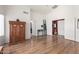 Airy bedroom featuring hardwood flooring, vaulted ceilings, and easy access to other rooms at 10322 E Excavation Ct, Gold Canyon, AZ 85118