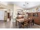 An open-concept dining space showcases a traditional table setting, complemented by a decorative hutch at 10322 E Excavation Ct, Gold Canyon, AZ 85118