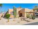 Charming desert home featuring a low-maintenance yard with native cacti and desert landscaping at 10322 E Excavation Ct, Gold Canyon, AZ 85118
