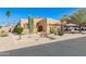 Charming single-story home with desert landscaping and a two-car garage at 10322 E Excavation Ct, Gold Canyon, AZ 85118