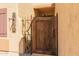Charming rustic wooden gate with wrought iron detail nestled in desert landscape entrance at 10322 E Excavation Ct, Gold Canyon, AZ 85118