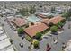 Aerial view showcases a community pool, tennis courts, and recreation center at 111 S Greenfield Rd # 313, Mesa, AZ 85206