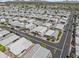 Wide aerial view of an active senior community with many homes and palm trees at 111 S Greenfield Rd # 313, Mesa, AZ 85206
