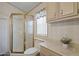Bathroom featuring a glass enclosed shower and vanity at 111 S Greenfield Rd # 313, Mesa, AZ 85206