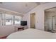 Bedroom offering a ceiling fan, closet space, desk, and ensuite bathroom at 111 S Greenfield Rd # 313, Mesa, AZ 85206