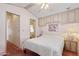 Comfortable bedroom featuring a ceiling fan, ensuite bathroom, and bright natural lighting at 111 S Greenfield Rd # 313, Mesa, AZ 85206