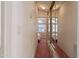 Hallway features mirrored closet and leads to a bedroom with built in dresser at 111 S Greenfield Rd # 313, Mesa, AZ 85206