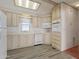 Bright kitchen with white appliances, plenty of cabinet space, and laminate flooring at 111 S Greenfield Rd # 313, Mesa, AZ 85206