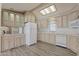 Bright kitchen features wood-tone cabinetry, updated appliances, and recessed lighting at 111 S Greenfield Rd # 313, Mesa, AZ 85206