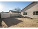A large backyard with a shed and cinder block fence is ready for customization at 11835 W Windsor Ave, Avondale, AZ 85392