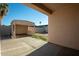 Wide view of the backyard which has a covered patio structure and plenty of room to roam at 11835 W Windsor Ave, Avondale, AZ 85392