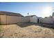 A vast backyard surrounded by a block fence, offers a secure outdoor space at 11835 W Windsor Ave, Avondale, AZ 85392