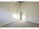 Neutral bedroom features carpet floors, two closets, and view to the bathroom through a doorway at 11835 W Windsor Ave, Avondale, AZ 85392