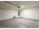 Spacious two-car garage with storage and a door to the backyard at 11835 W Windsor Ave, Avondale, AZ 85392