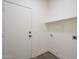 Laundry room features a utility sink and door to the exterior at 11835 W Windsor Ave, Avondale, AZ 85392