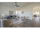 Cozy living room space with contemporary decor, a ceiling fan, and modern furniture at 11835 W Windsor Ave, Avondale, AZ 85392