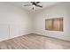 This spacious bedroom features modern wall trim and a large window at 12941 W Flower St, Avondale, AZ 85392