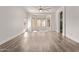 Spacious bedroom with wood-look flooring, a bay window, and an ensuite bathroom at 12941 W Flower St, Avondale, AZ 85392