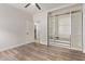 A spacious bedroom features modern floors, an open closet organizer, and a walk-out door at 12941 W Flower St, Avondale, AZ 85392