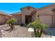 Charming single-story home featuring a one-car garage, desert landscaping, and a well-maintained front yard at 12941 W Flower St, Avondale, AZ 85392