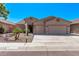 Charming single-story home featuring a two-car garage, desert landscaping, and a well-maintained front yard at 12941 W Flower St, Avondale, AZ 85392