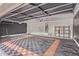 The garage features black and orange epoxy flooring and ample room for parking and storage at 12941 W Flower St, Avondale, AZ 85392