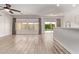 Open living area with kitchen, bar area, and sliding glass doors leading to a private pool at 12941 W Flower St, Avondale, AZ 85392
