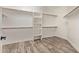 Very large walk-in closet with a variety of shelves and racks at 12941 W Flower St, Avondale, AZ 85392