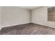 Bedroom with wood-look flooring and a window providing natural light at 1342 W Emerald Ave # 381, Mesa, AZ 85202