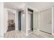 Inviting entryway with tiled floors, mirrored closet, and updated lighting at 1342 W Emerald Ave # 381, Mesa, AZ 85202