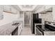 Updated kitchen features stainless steel appliances, granite counters, and sleek modern cabinetry at 1342 W Emerald Ave # 381, Mesa, AZ 85202