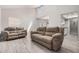 Bright living room with high ceilings, neutral tones, and tiled flooring at 1342 W Emerald Ave # 381, Mesa, AZ 85202