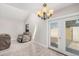 Bright living room space features tiled floors and a view of french doors at 1342 W Emerald Ave # 381, Mesa, AZ 85202