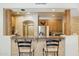 Open kitchen featuring a breakfast bar, stainless steel appliances, and stylish counter seating at 13600 N Fountain Hills Blvd # 405, Fountain Hills, AZ 85268