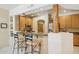 Charming kitchen featuring a breakfast bar, wooden accents, and stainless steel appliances at 13600 N Fountain Hills Blvd # 405, Fountain Hills, AZ 85268