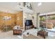 Spacious living room with high ceilings, tile flooring, and sliding glass doors to the patio at 13600 N Fountain Hills Blvd # 405, Fountain Hills, AZ 85268