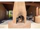 Inviting outdoor fireplace with comfortable seating, perfect for relaxing evenings by the fire at 13600 N Fountain Hills Blvd # 405, Fountain Hills, AZ 85268
