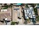 Aerial view of home with a private pool, spa, patio, and solar panels at 14437 W Lexington Ave, Goodyear, AZ 85395