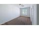 Bright bedroom with neutral carpet and a window that lets in lots of natural light at 14437 W Lexington Ave, Goodyear, AZ 85395