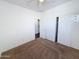 Spacious bedroom with a ceiling fan, large closet, and neutral carpeting at 14437 W Lexington Ave, Goodyear, AZ 85395