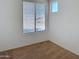 Neutral bedroom with window offering natural light and carpeted flooring at 14437 W Lexington Ave, Goodyear, AZ 85395