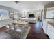 Open-concept dining and living area with modern furnishings, lots of windows, and stylish design elements at 14437 W Lexington Ave, Goodyear, AZ 85395