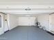 Spacious two-car garage with finished floor and direct access to the home's interior at 14437 W Lexington Ave, Goodyear, AZ 85395