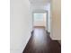 Hallway featuring hard surface flooring and an archway to the bedroom at 14437 W Lexington Ave, Goodyear, AZ 85395