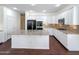 Spacious kitchen with a large island, granite countertops, and stainless steel appliances at 14437 W Lexington Ave, Goodyear, AZ 85395