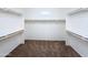 Spacious walk-in closet with carpet flooring and ample shelving space at 14437 W Lexington Ave, Goodyear, AZ 85395