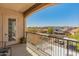 Inviting balcony with wrought-iron railing offering scenic views of the neighborhood at 14575 W Mountain View Blvd # 10313, Surprise, AZ 85374