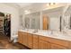 Light and airy bathroom with double sinks, ample counter space, with walk-in closet and glass shower at 14575 W Mountain View Blvd # 10313, Surprise, AZ 85374